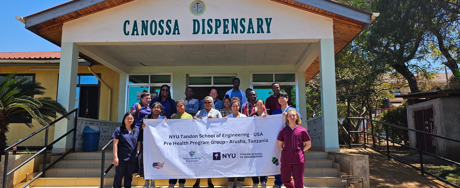 NYU Tandon School of Engineering pre-health student group outside a dispensary in Arusha, Tanzania